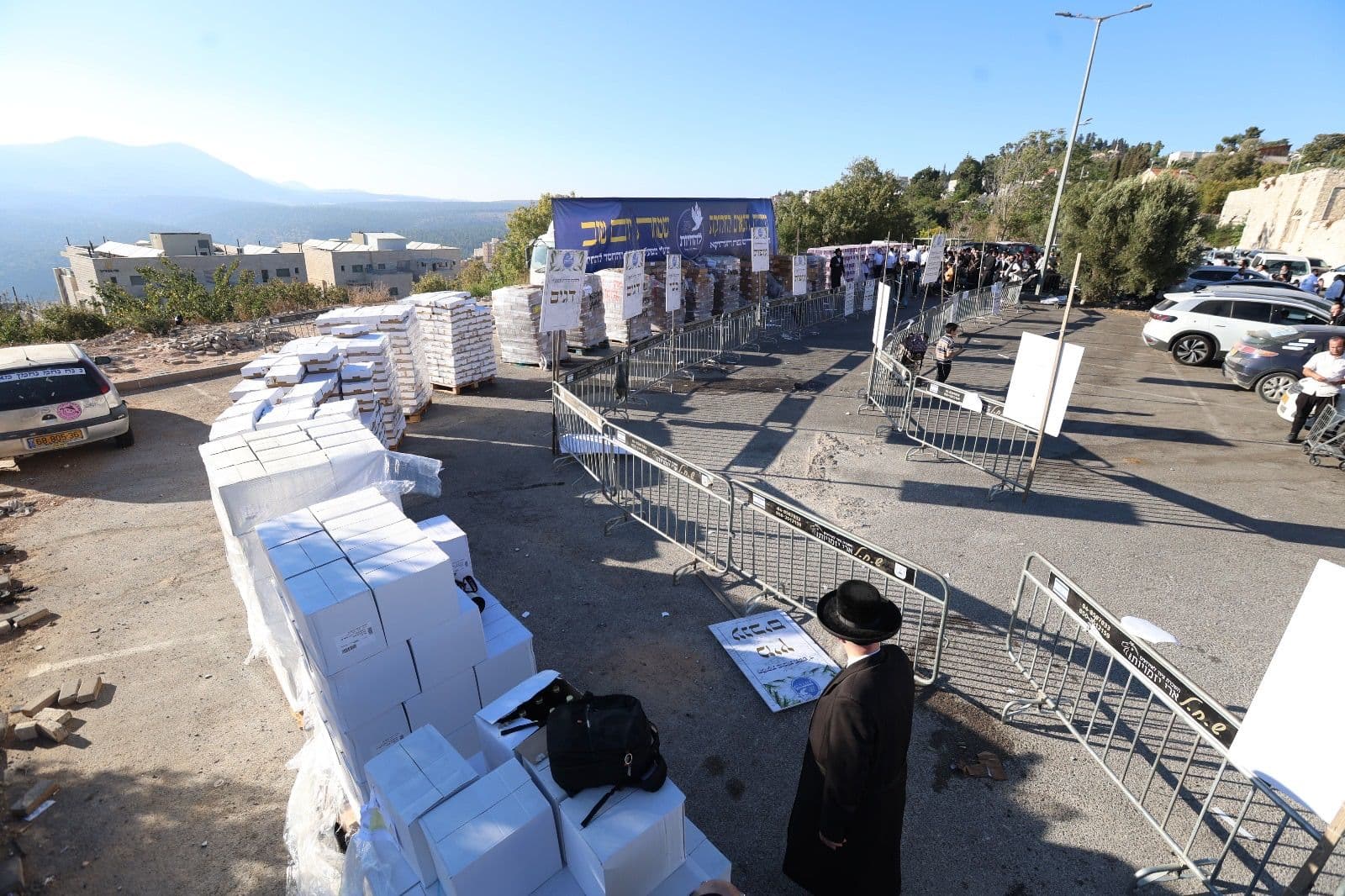 The distribution site from above: pallets, barriers, and boxes laid out in rows